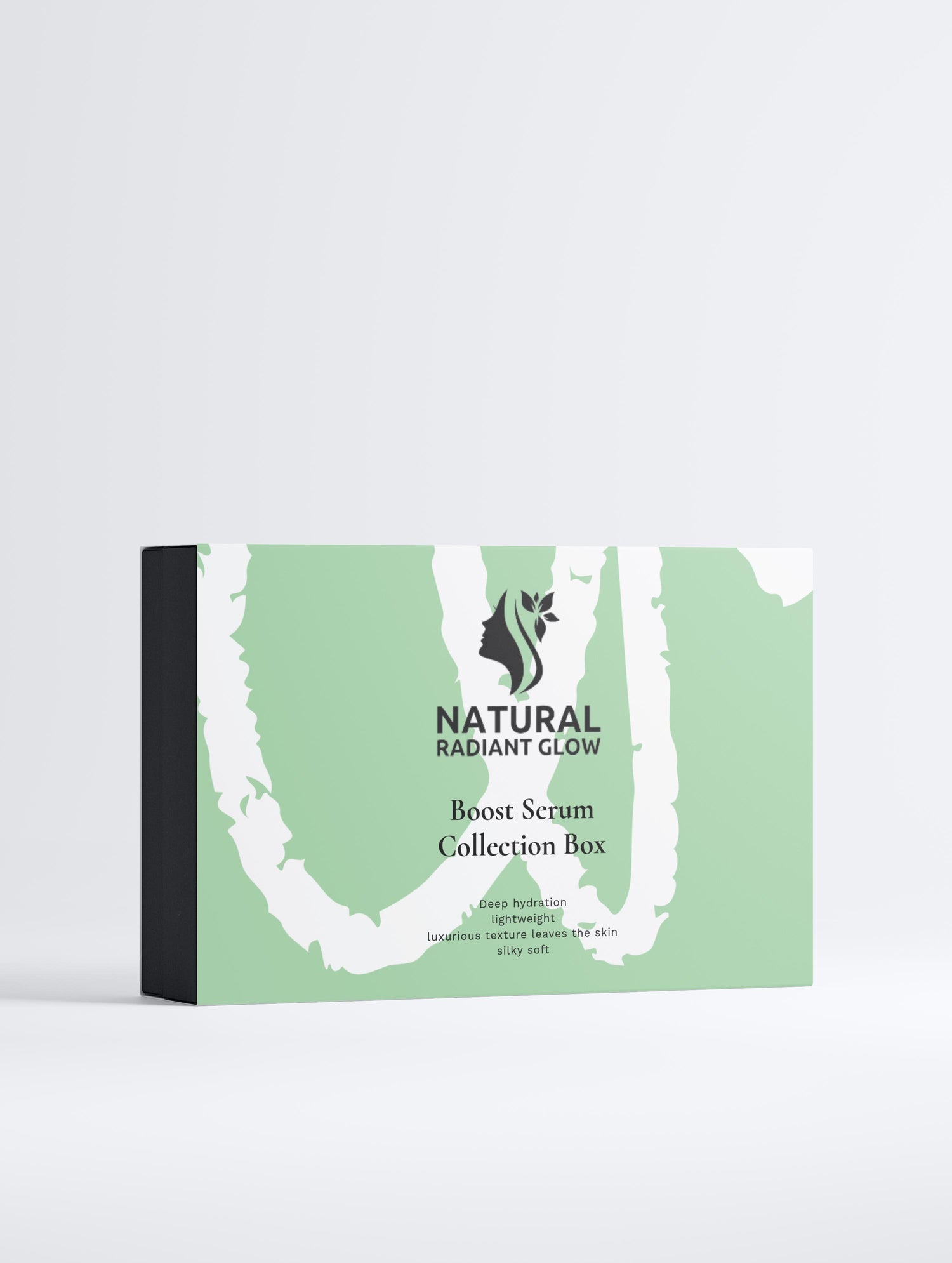 A collection box labeled 'Natural Radiant Glow Serum Collection Box' containing skincare serums, designed to enhance skin elasticity and firmness.